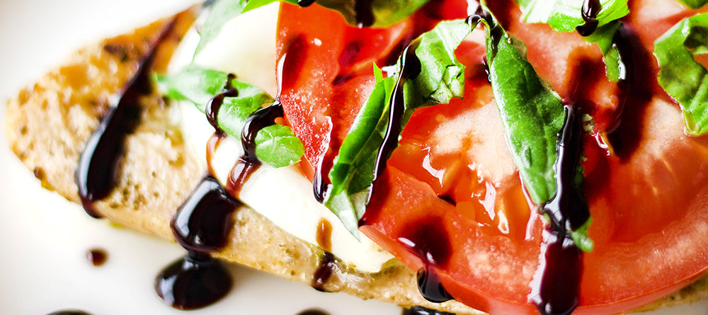 Balsamic glaze on chicken, mozzarella cheese, tomato and basil