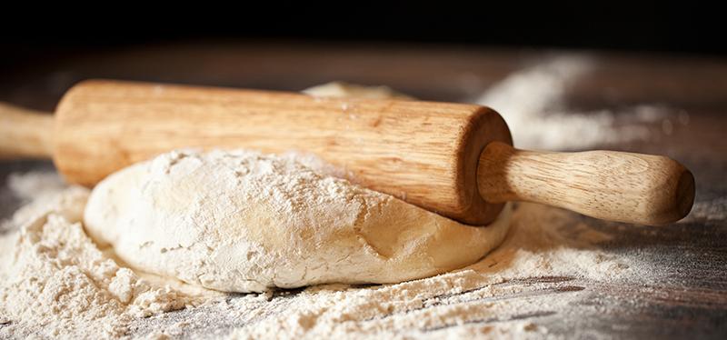 Italian flour pizza dough with rolling pin