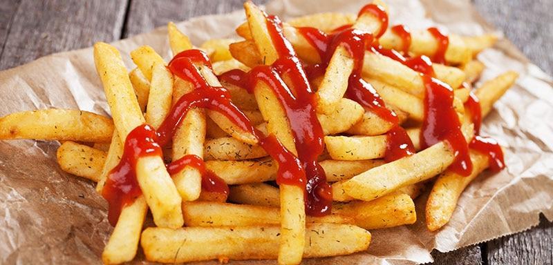 Golden french fries with ketchup