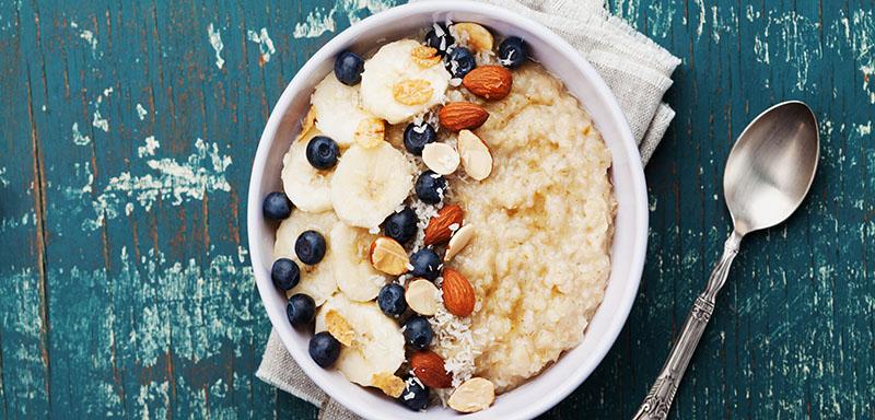 Healthy bowl of oatmeal with blueberries, bananas, and nuts