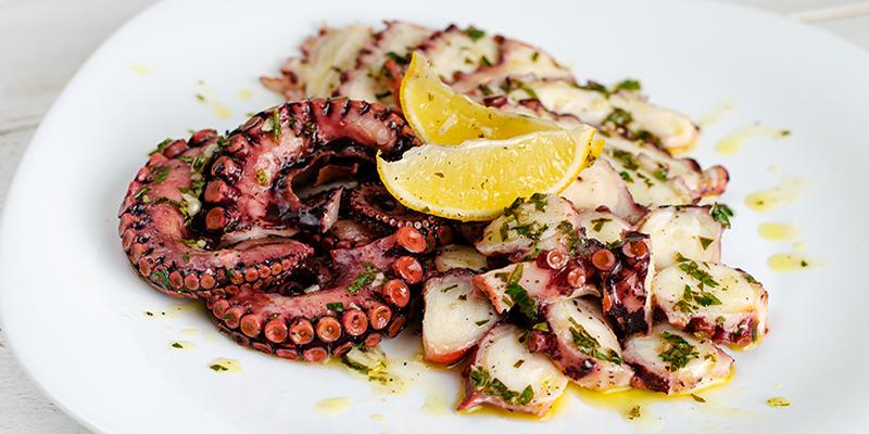 Octopus tentacles with lemon and herbs