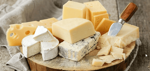 Selection of swiss cheese, brie cheese, blue cheese, parmigiano reggiano