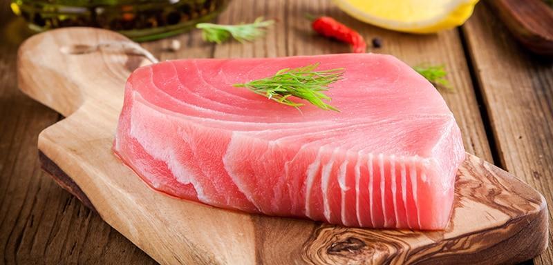 Rare Tuna Fish on a Wooden Cutting Board