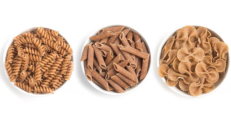 three bowls of whole wheat pasta shapes